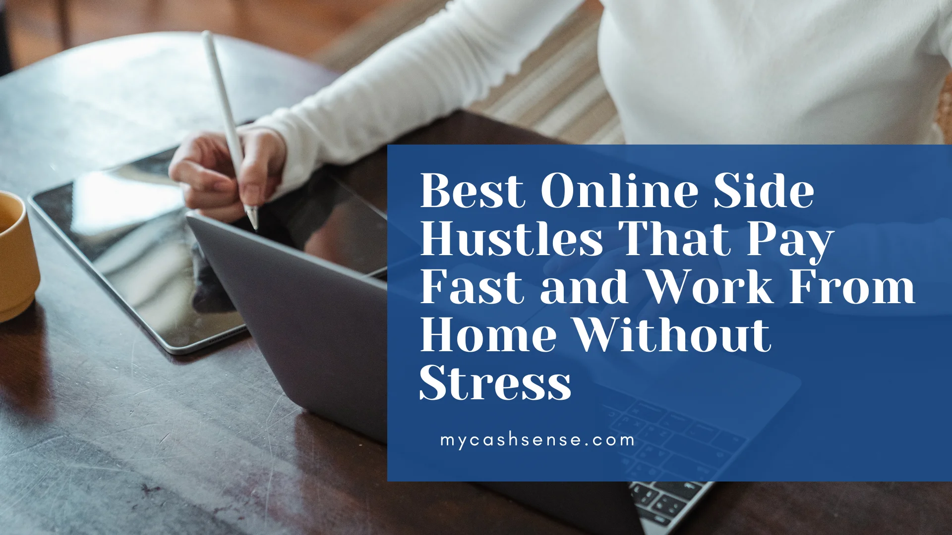 Close-up of a person in a white shirt using a stylus on a tablet next to an open laptop on a dark wooden desk, overlaid with a blue graphic stating "Best Online Side Hustles That Pay Fast and Work From Home Without Stress."