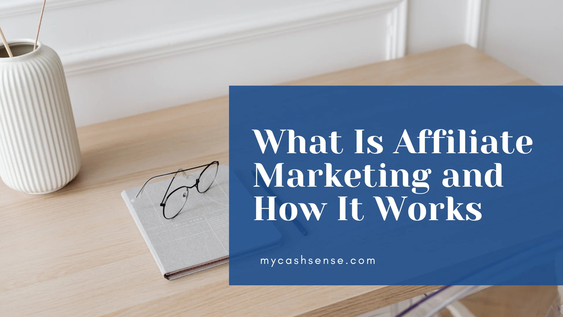 The image showing a book and glasses on the table with a text overlay beside it "What Is Affiliate Marketing and How it Works"