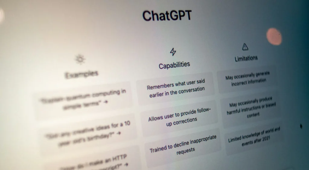 Screen displaying ChatGPT interface with sections for Examples, Capabilities, and Limitations.