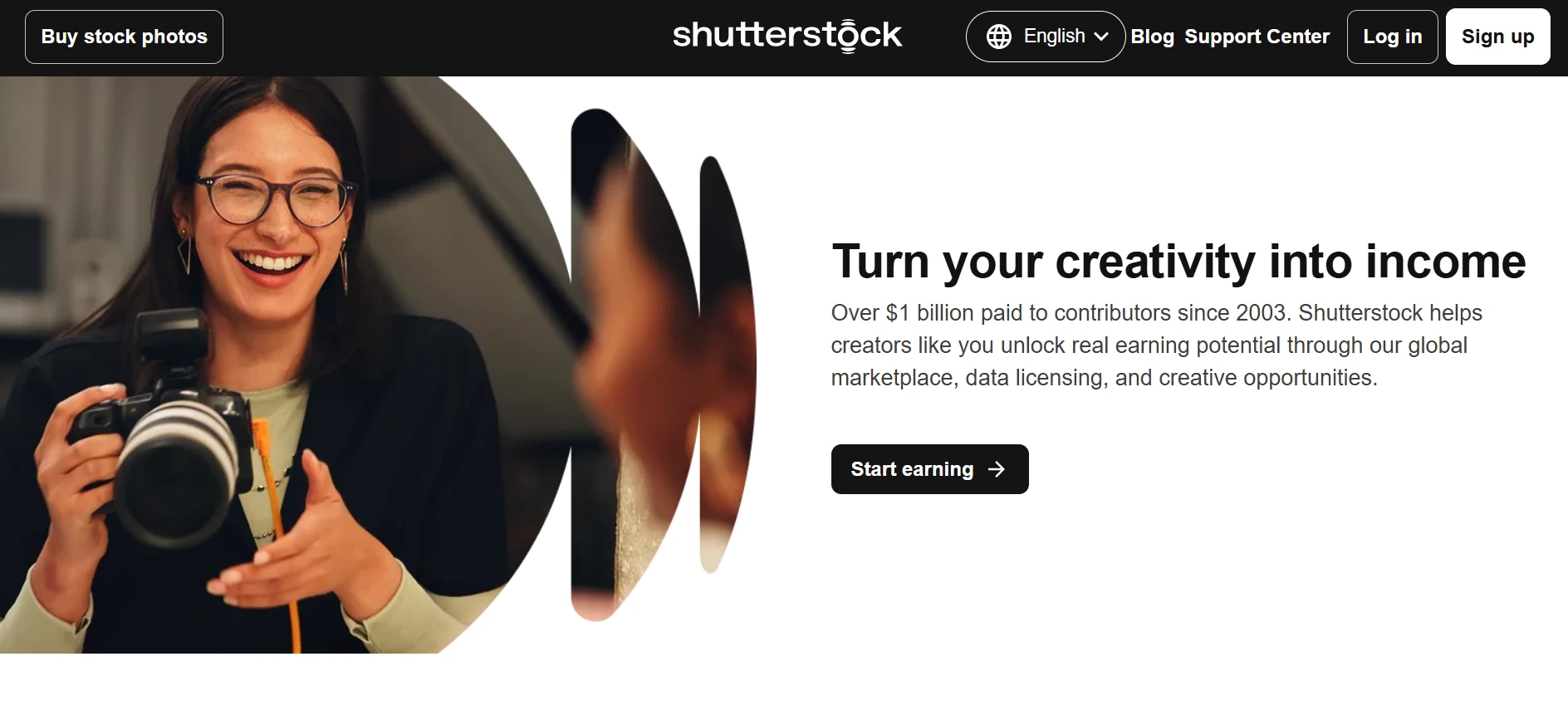 Smiling woman wearing glasses holds a camera beside text reading “Turn your creativity into income” and a “Start earning” button.